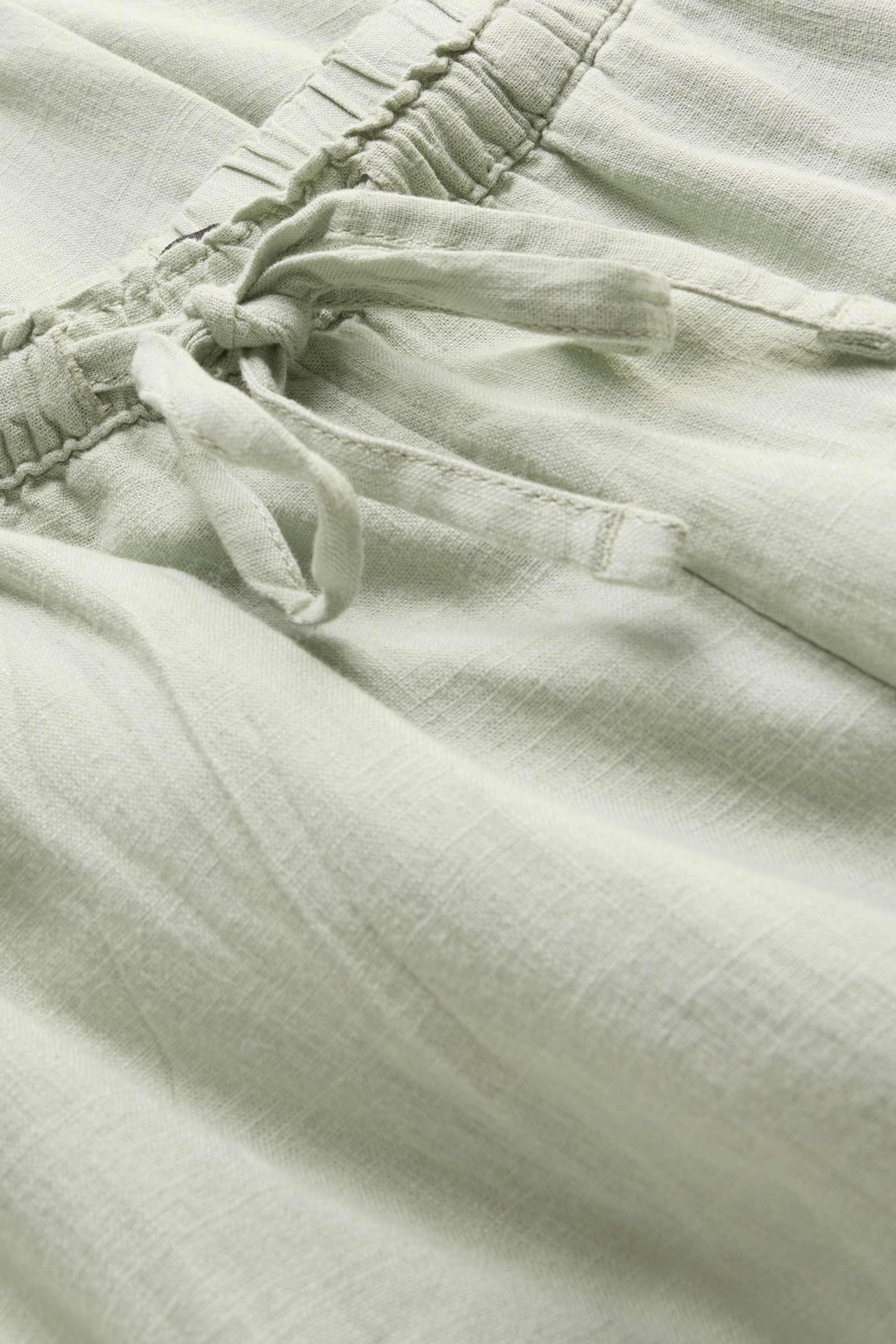 Cloth trousers with linen content - mid-rise waist - loose fit green