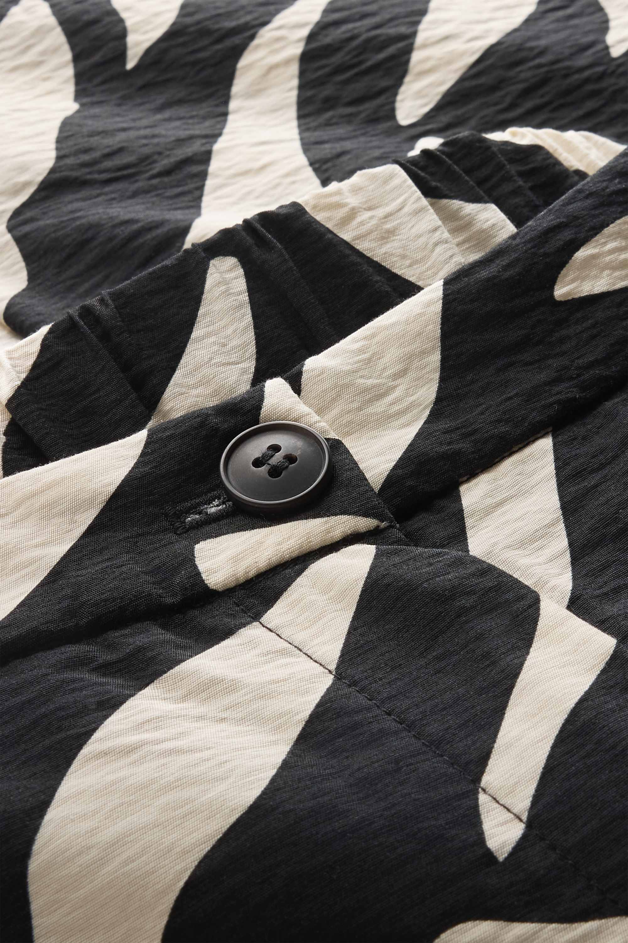 Cloth trousers - high waist - wide leg - patterned black / white