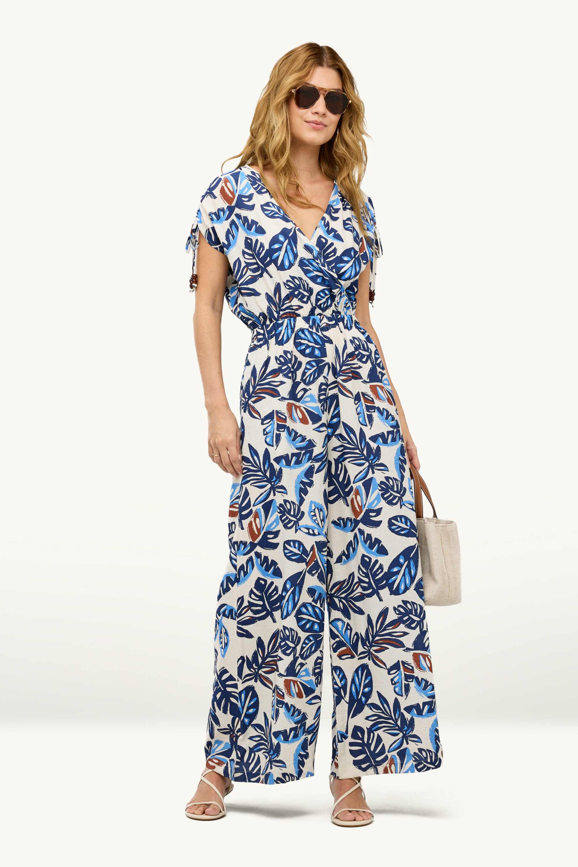 V-neck jumpsuit with beads - patterned blue / white