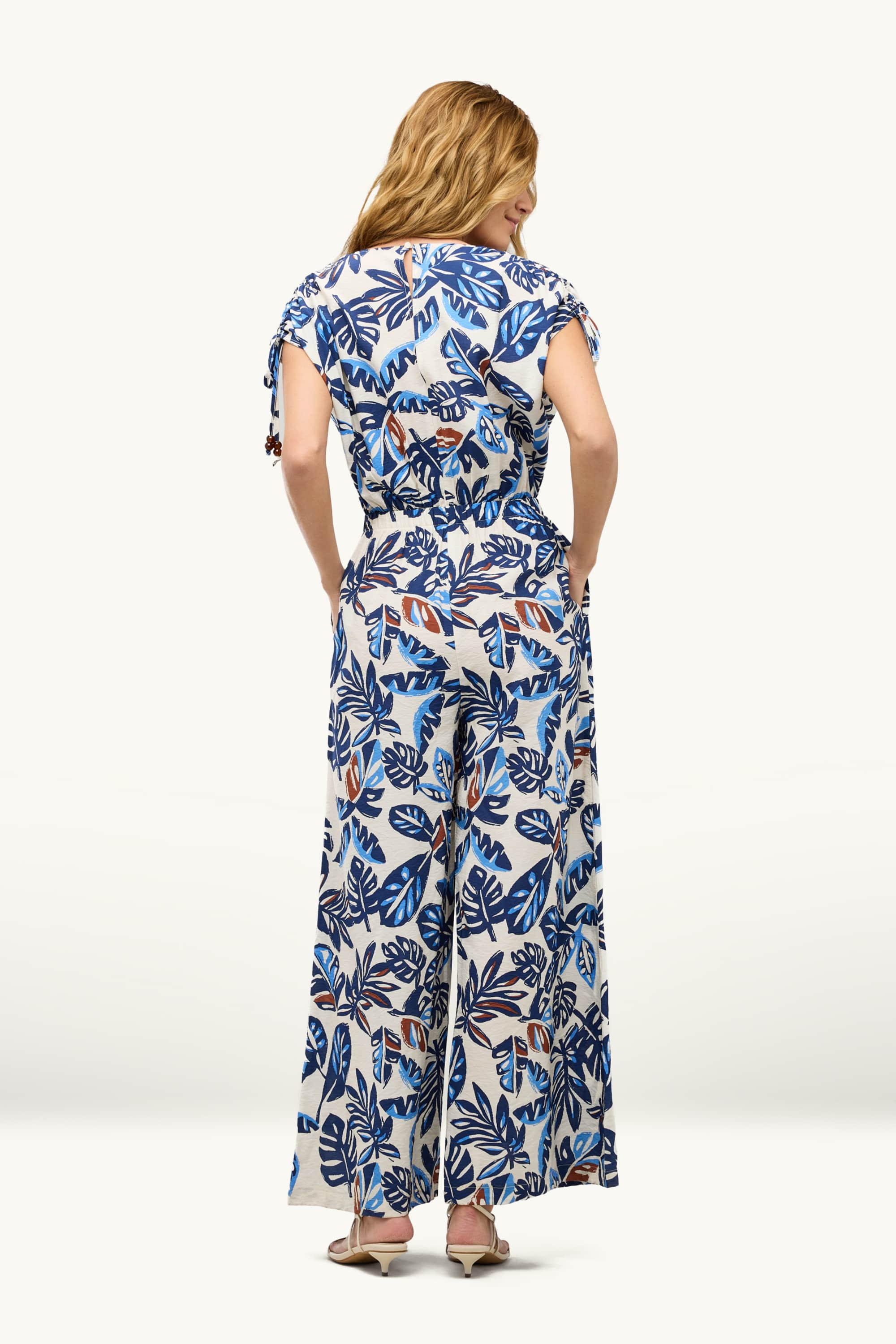V-neck jumpsuit with beads - patterned blue / white