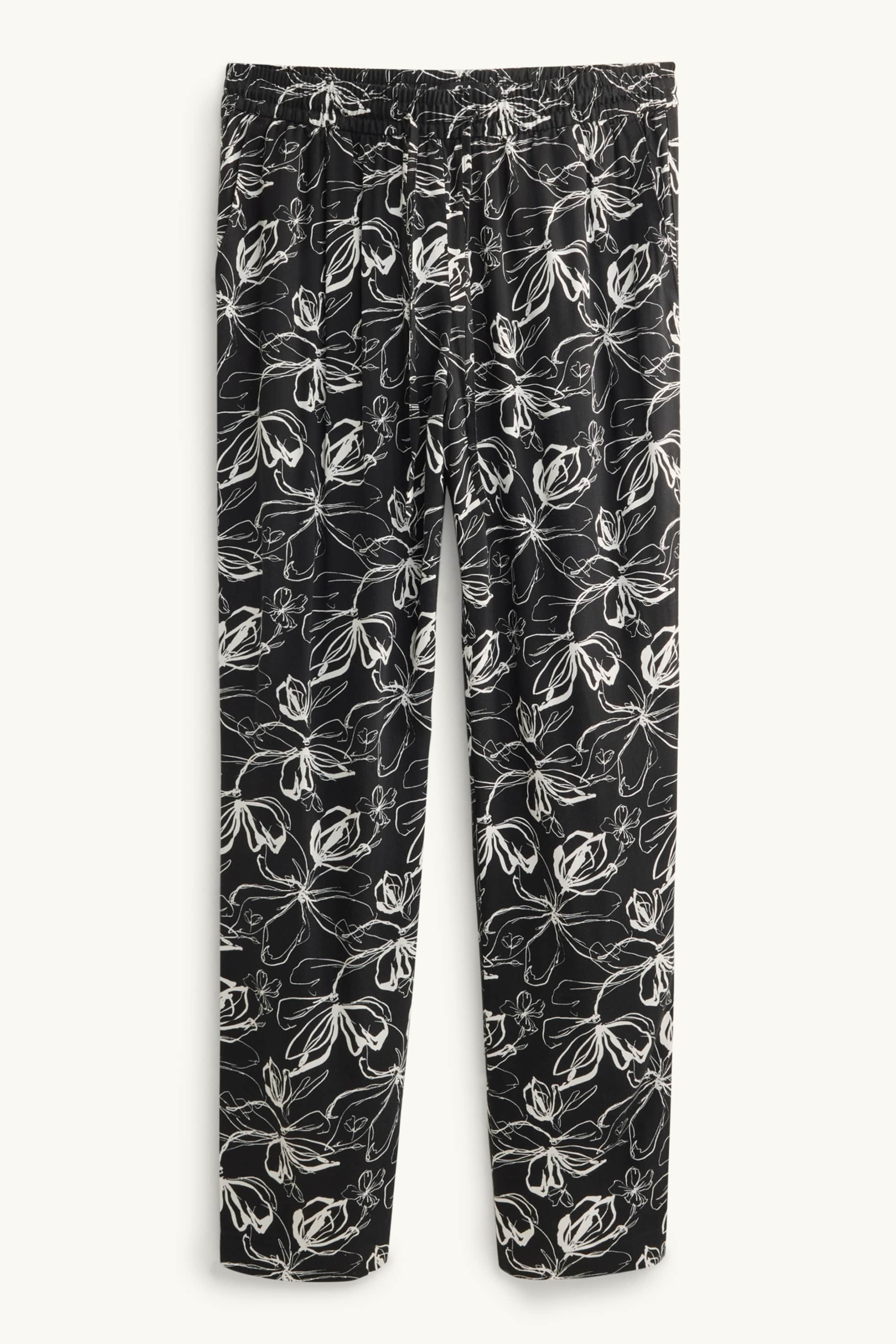 Cloth trousers - mid-rise waist - tapered fit - floral white / black