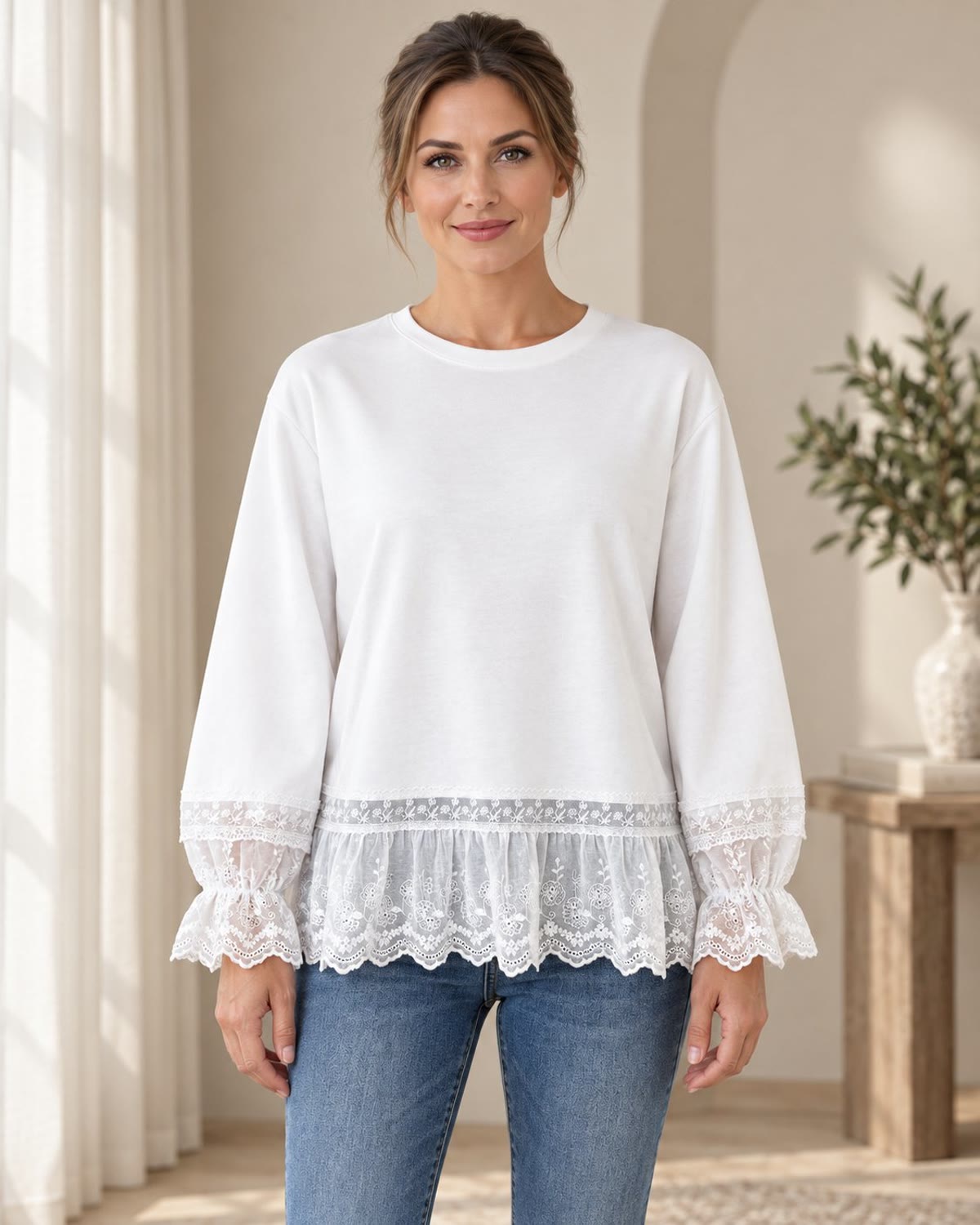 White lace-trim sweatshirt styled with blue jeans, front view