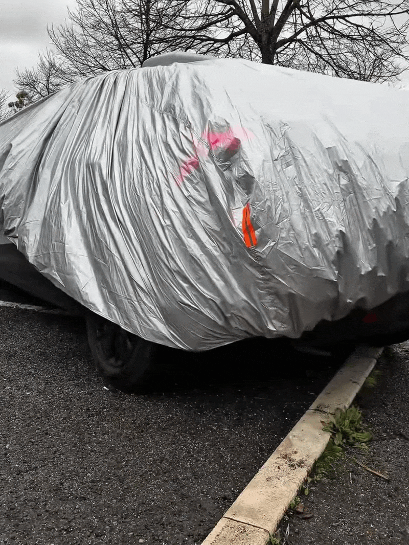 Automatic car cover in its retracted, compact position