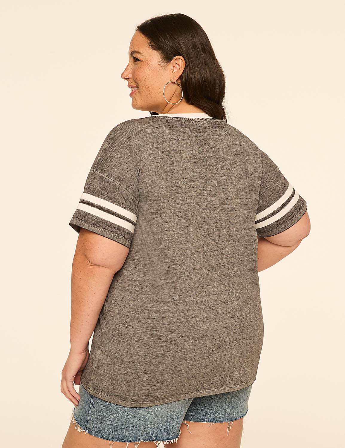 A woman in a grey t-shirt and denim shorts stands against a plain, light-colored background. Product Image 2