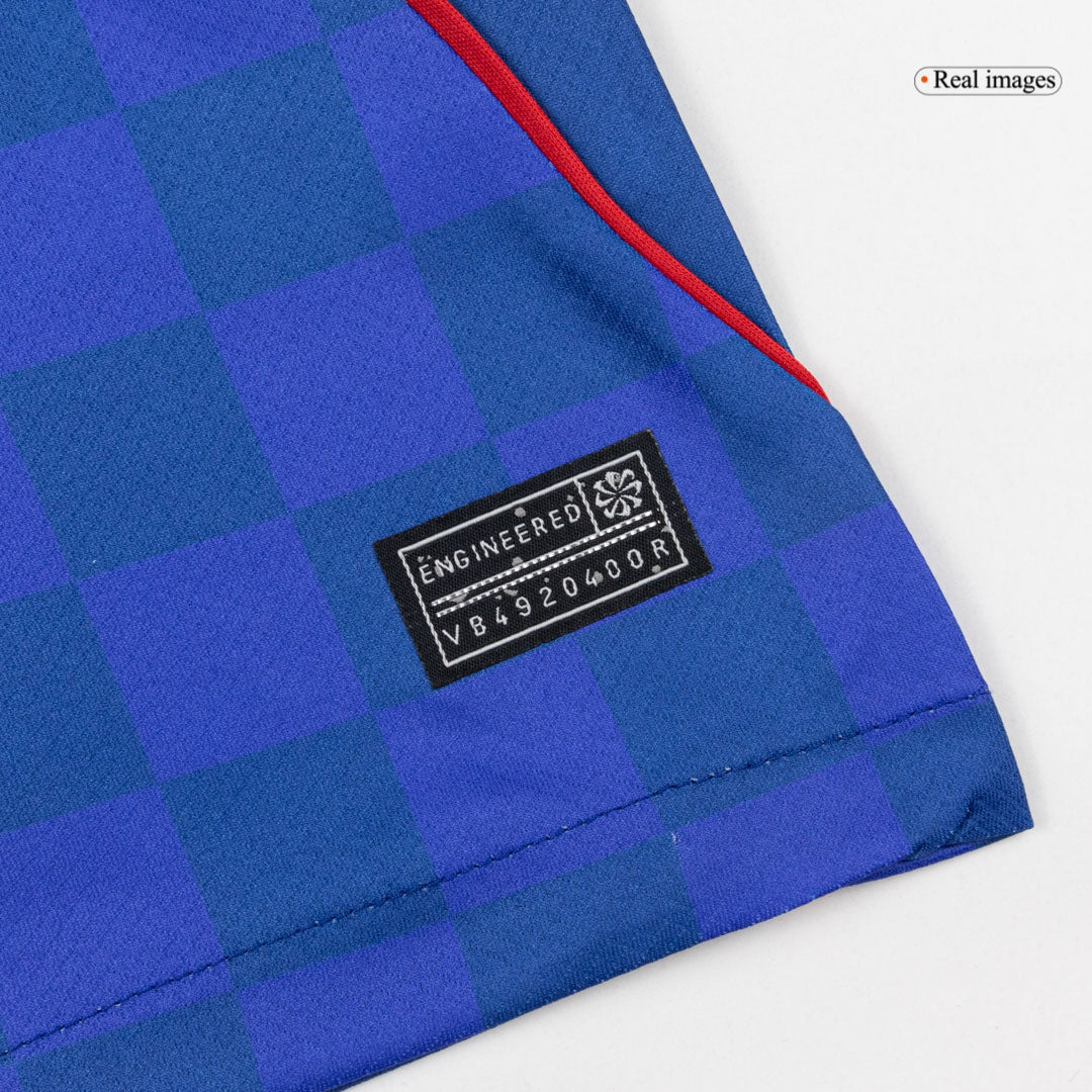 Close-up of the blue and red checkered hem and woven label on the men's Croatia 2026 Away jersey