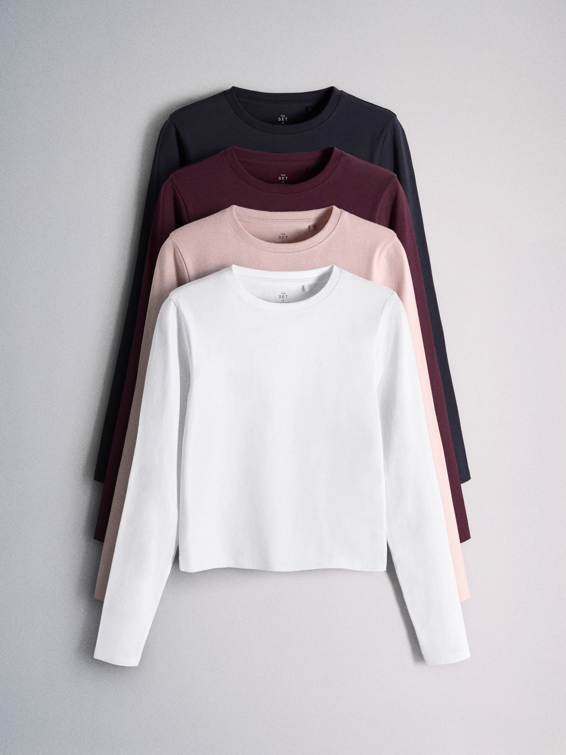 The Set 4 Pack Long Sleeve Skinny Fit Cropped T-Shirts - Burgundy Red/Navy Blue/Pink/White - Regular - SIP Still Life