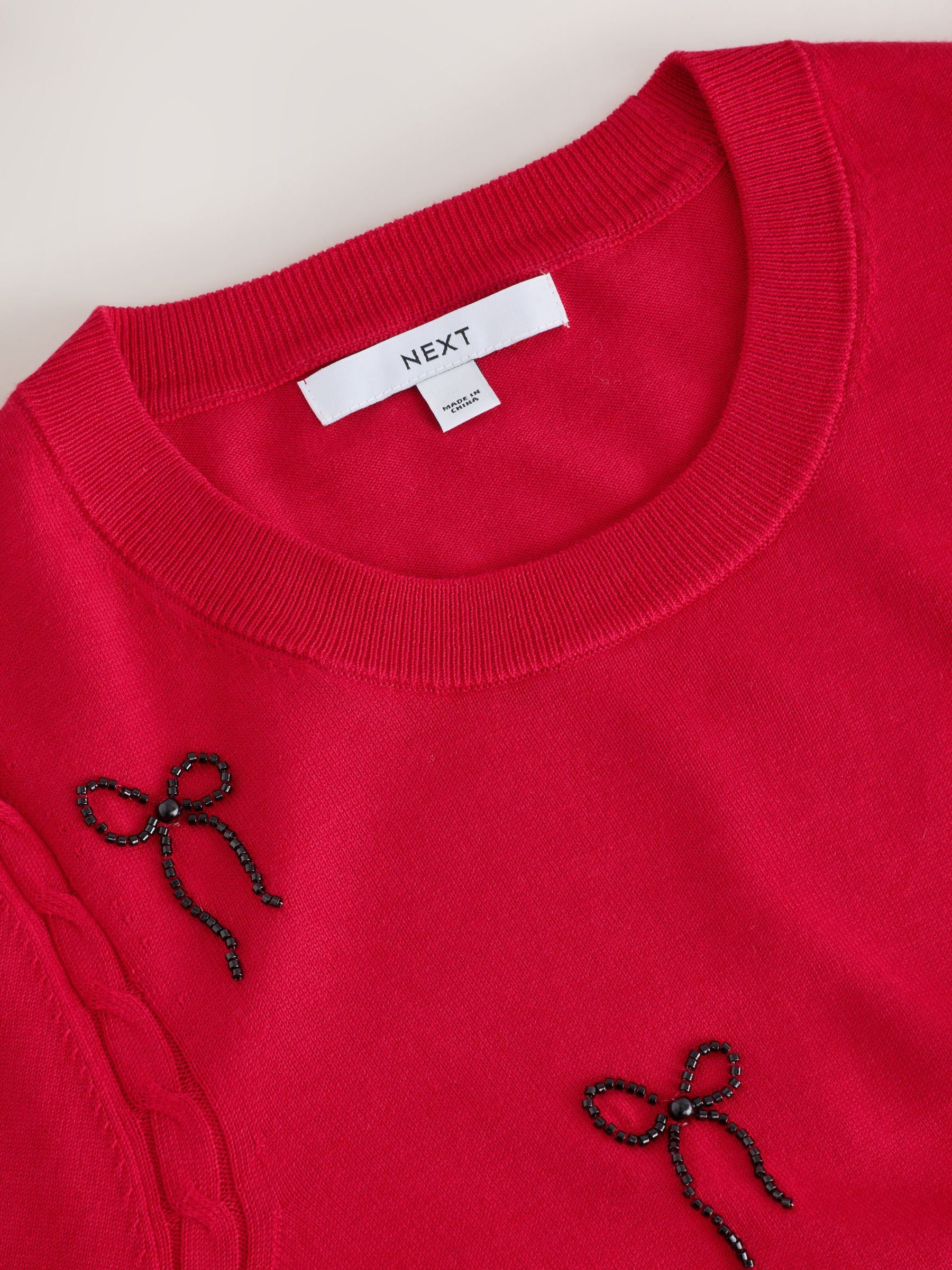 Cotton Rich Soft Touch Long Sleeve Crew Neck Jumper - Red Embellished Bows - Regular - SIP Still Life