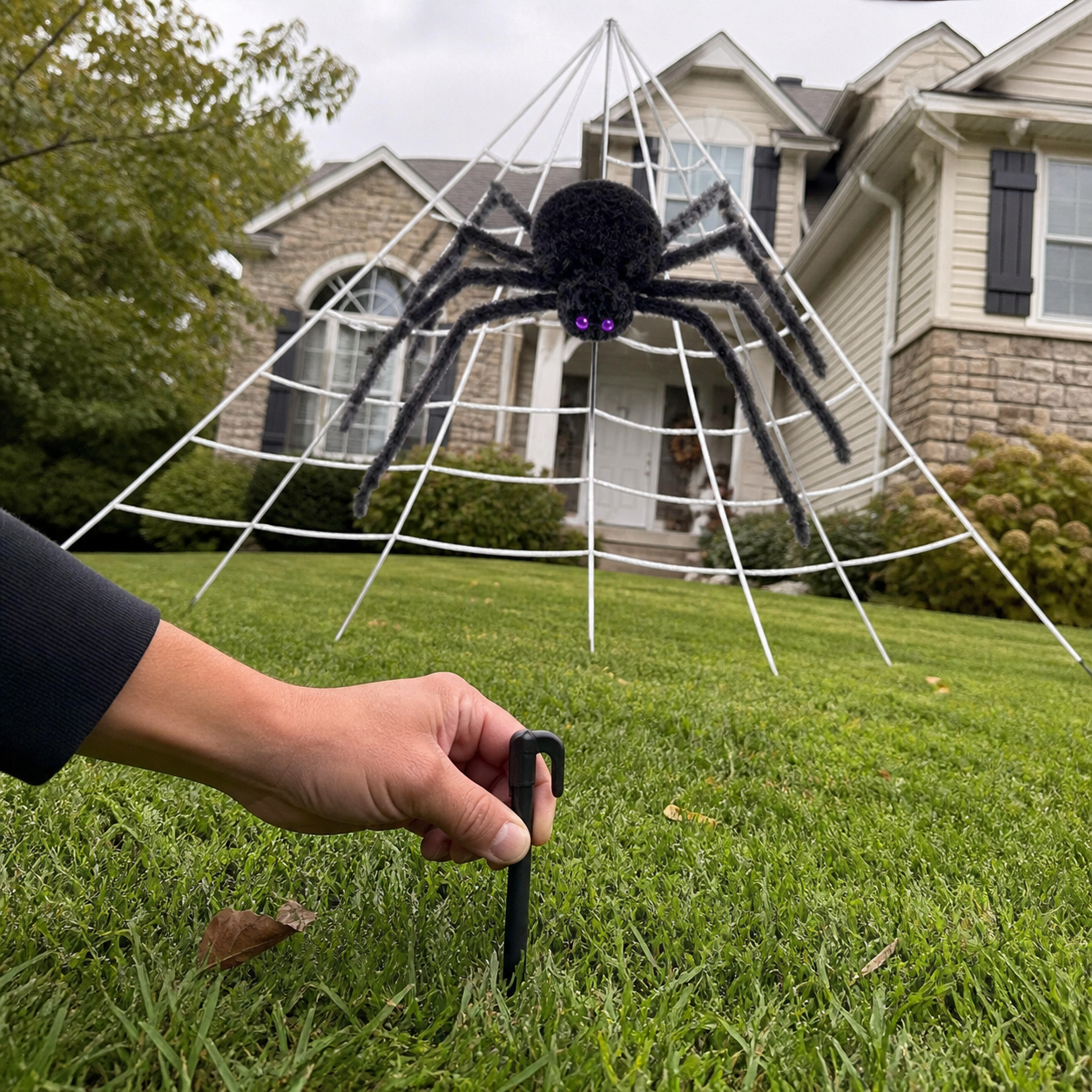 Customer-style inspiration showing the spider web kit in ground-stake placement