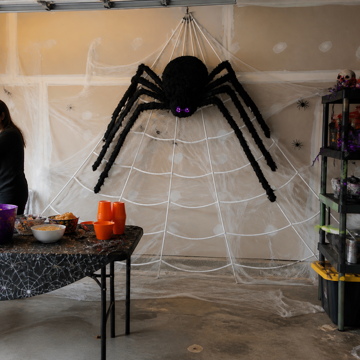 Customer-style inspiration showing the spider web kit in garage party backdrop