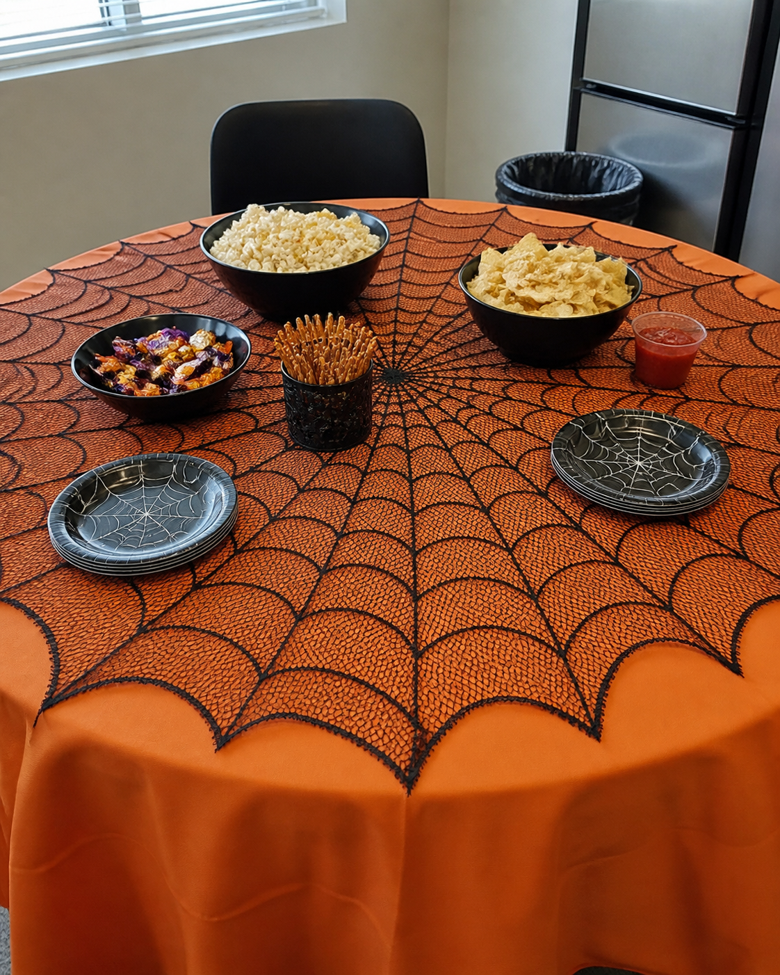 Spiderweb table topper party styling concept: office snack table