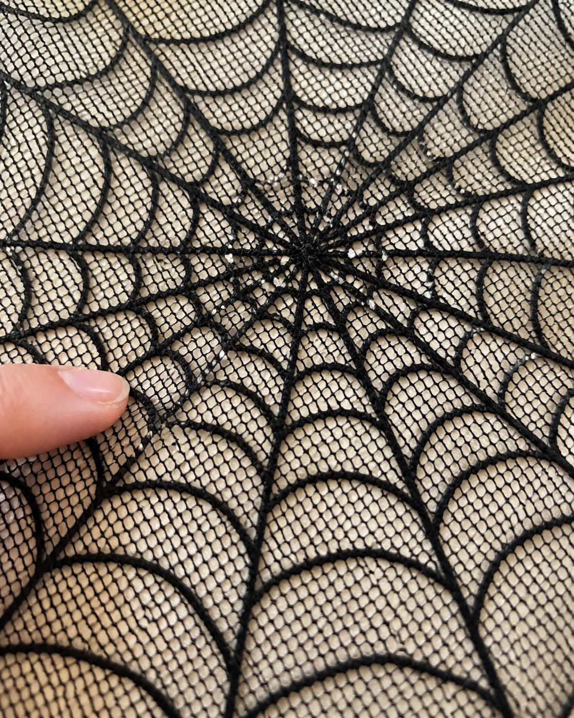 Spiderweb table topper party styling concept: mesh close-up