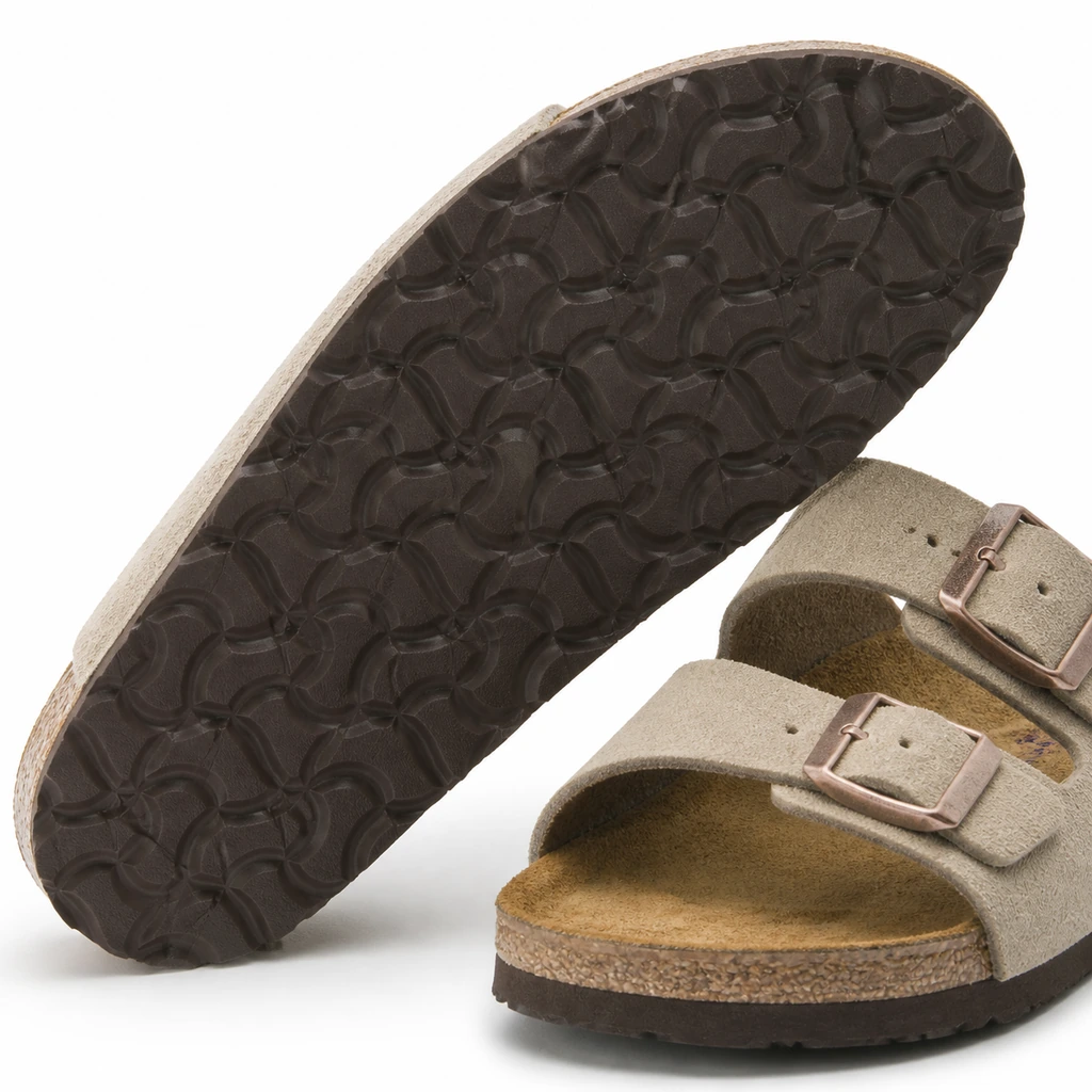 Close view of the textured outsole on two-strap sandals