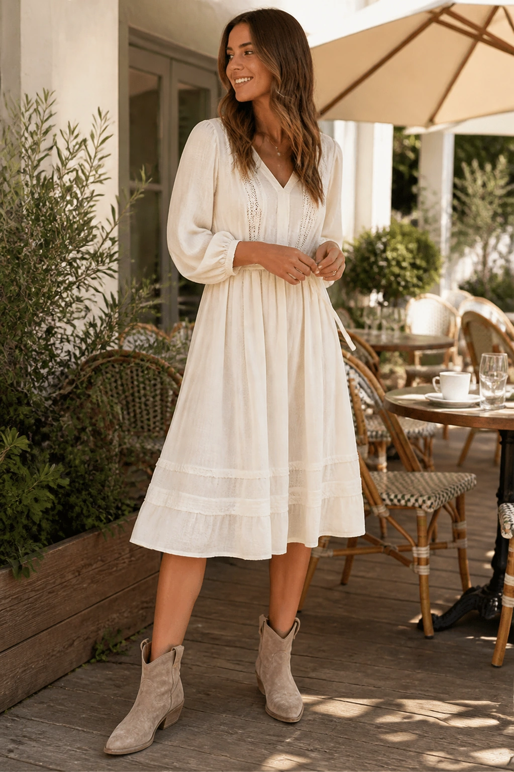 Woman styling Charlotte western ankle boots with a dress for brunch
