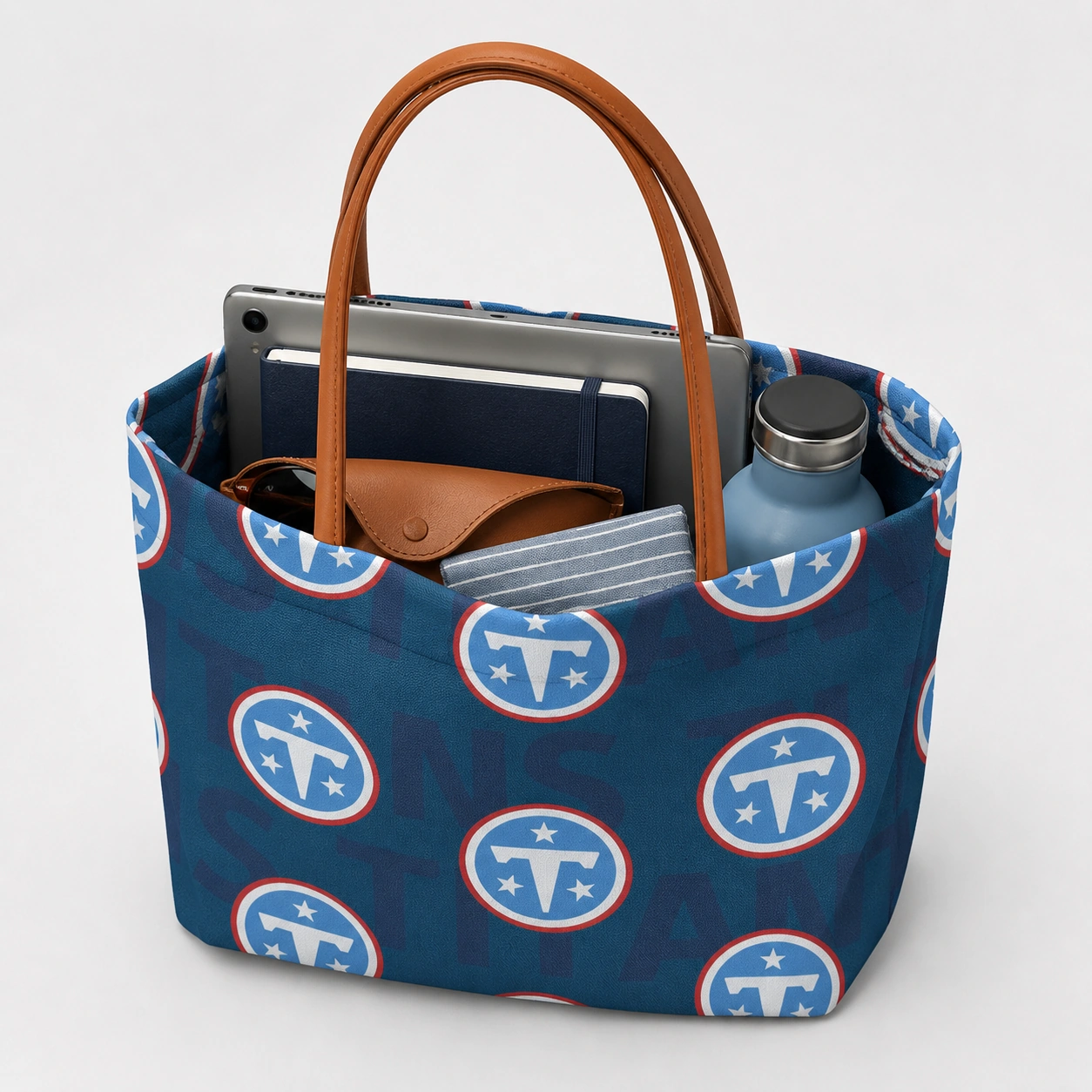 Open football print tote holding everyday essentials