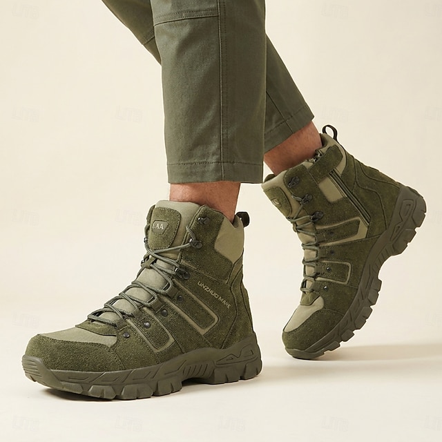 Man wearing green high-top utility-style boots with olive trousers