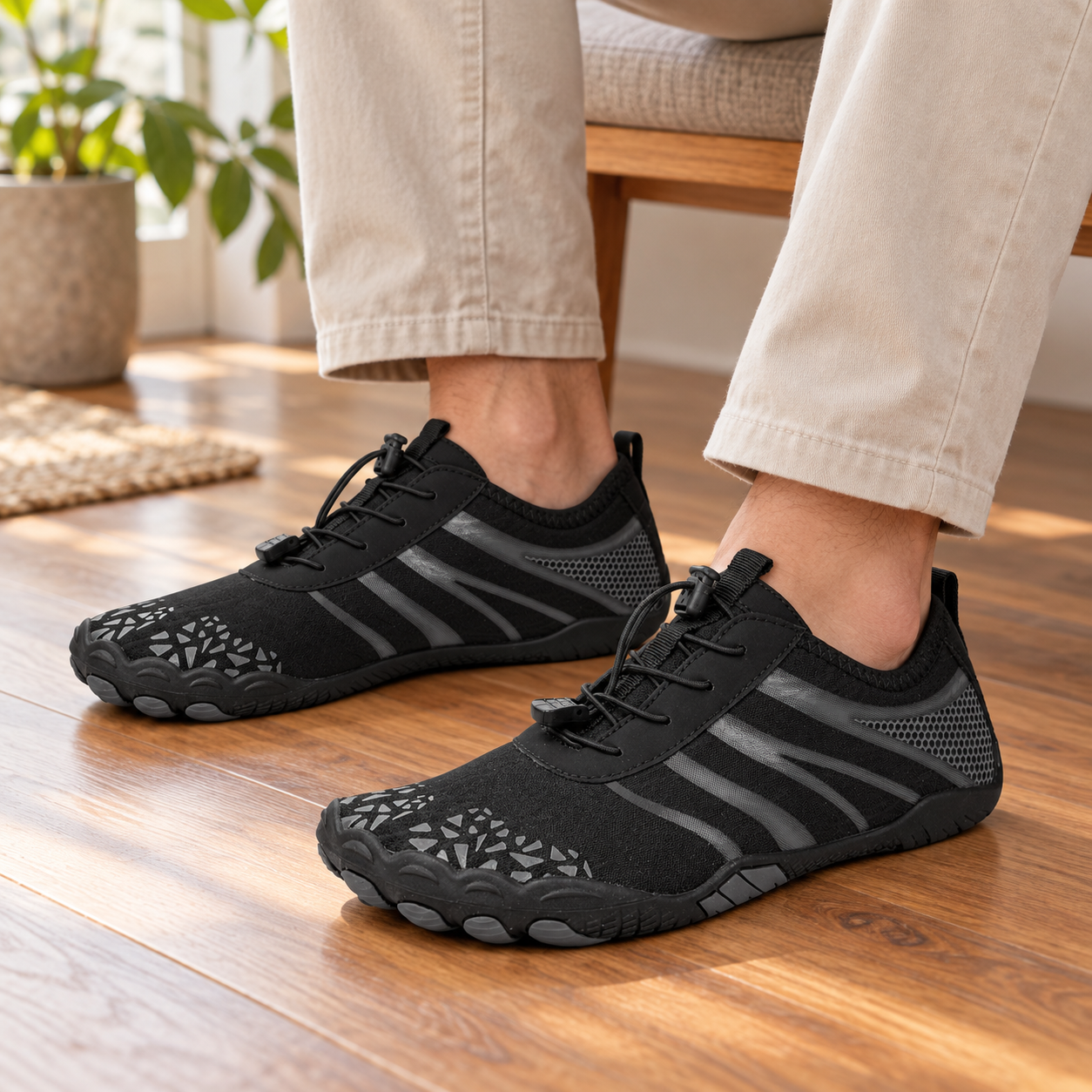 Model wearing black K11 barefoot-style mesh shoes