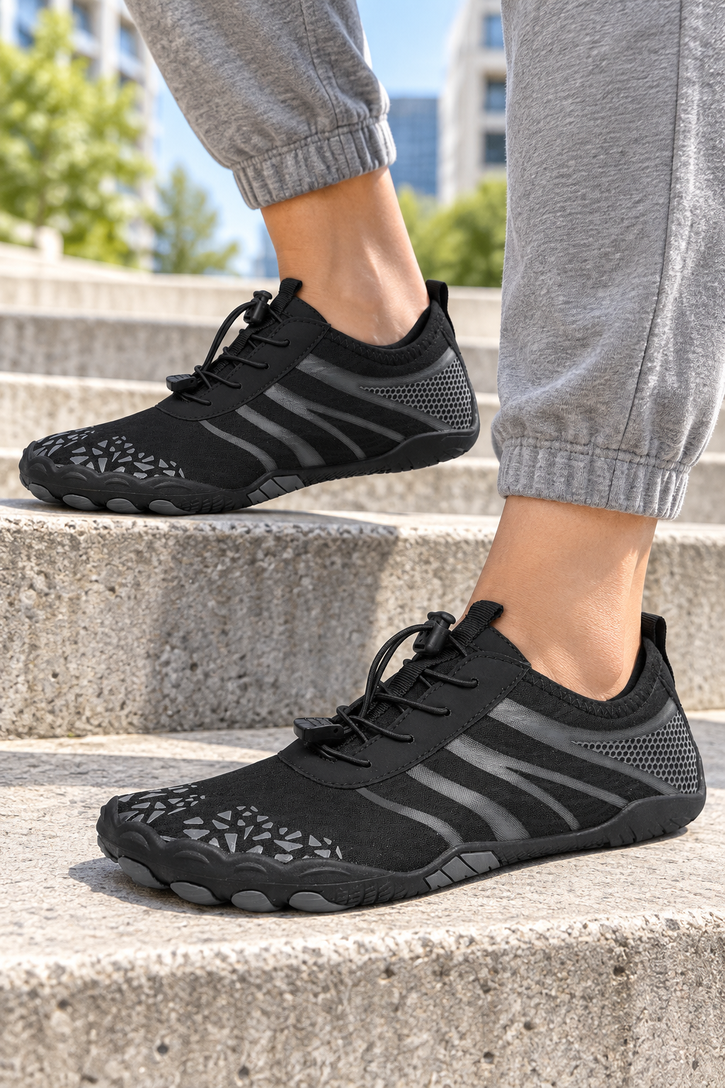 Model wearing black K11 barefoot-style mesh shoes