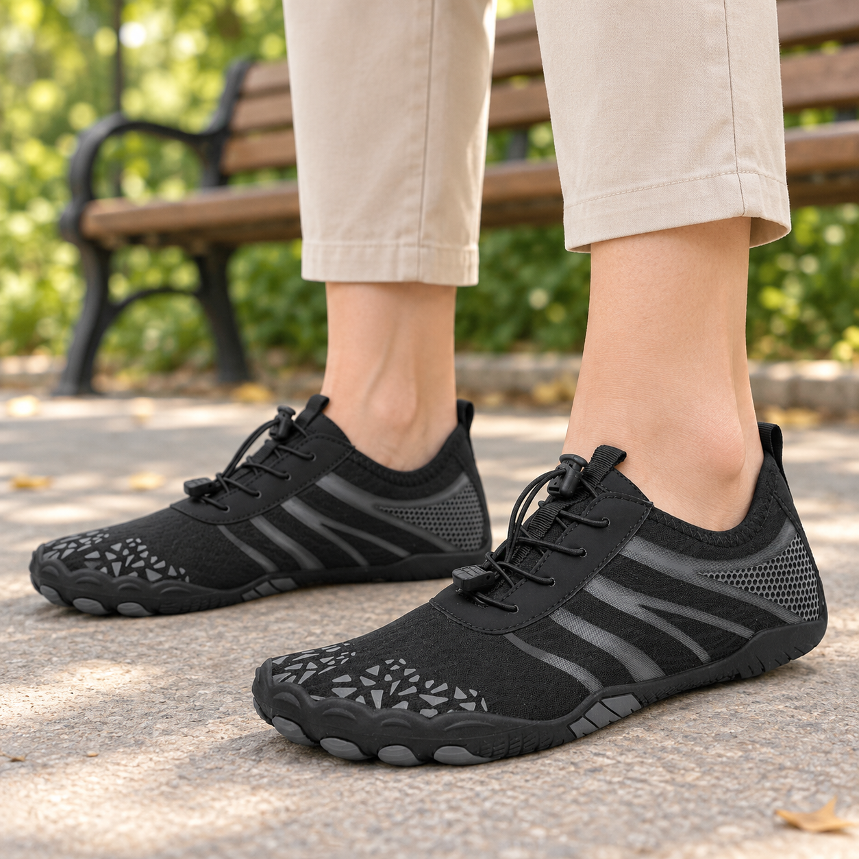 Model wearing black K11 barefoot-style mesh shoes