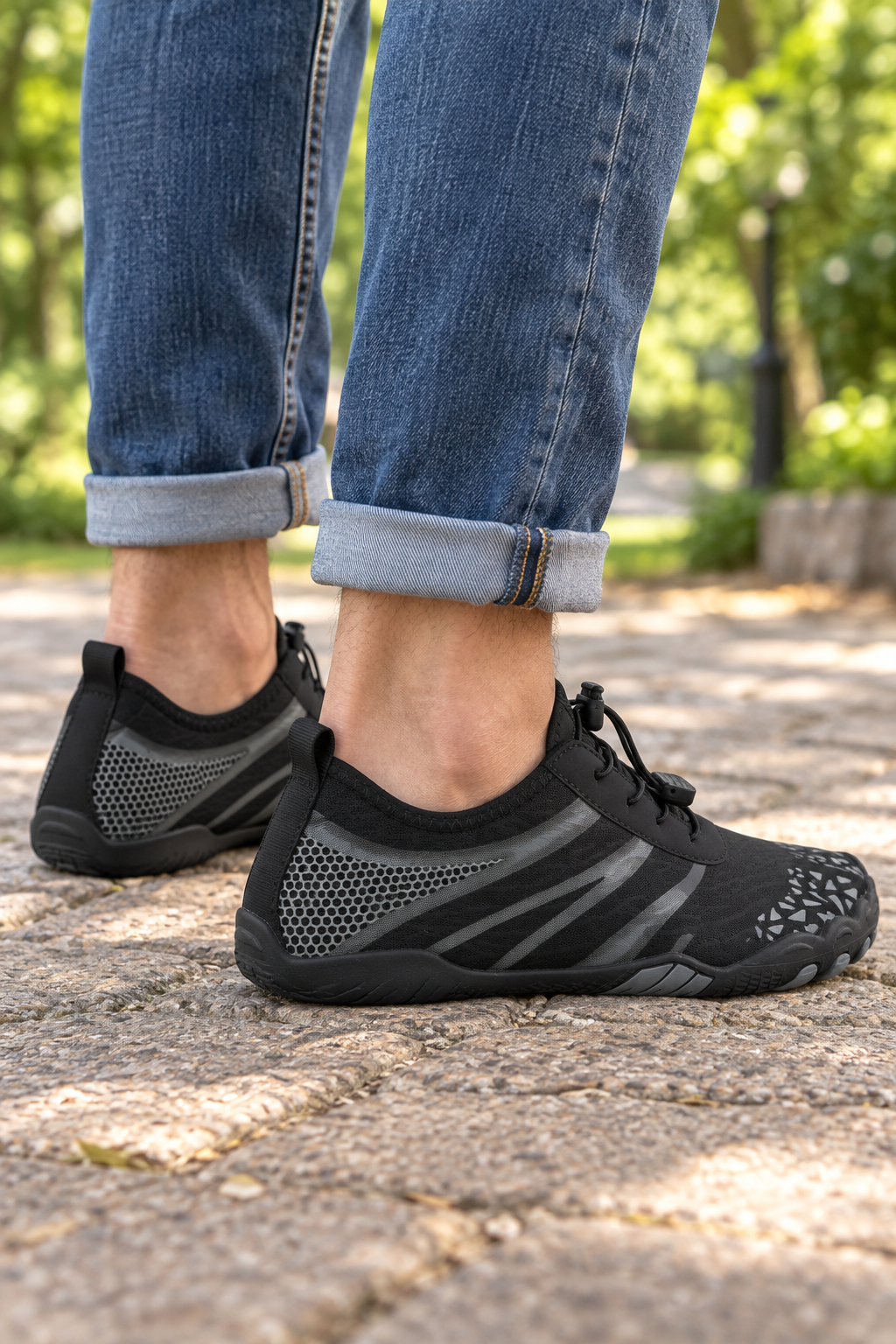 Model wearing black K11 barefoot-style mesh shoes