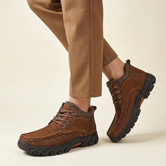 Man wearing brown moc-toe lace-up shoes with tan trousers
