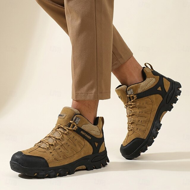 Man wearing brown lace-up outdoor shoes with tan trousers