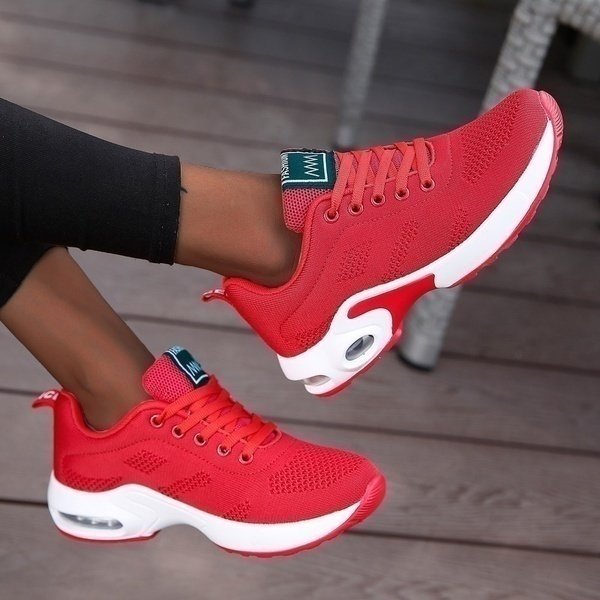Bright red, bold finish. On-foot product styling.