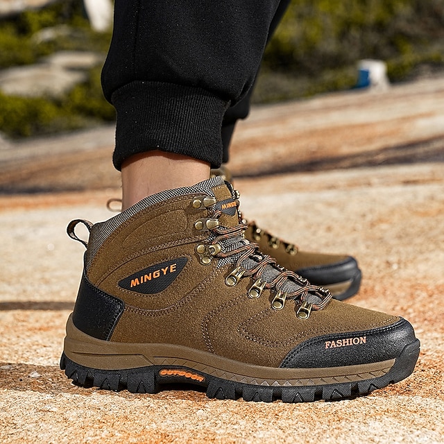 Side view of brown high-top boots on foot