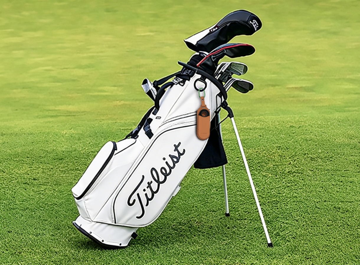 Hanging the MILESEEY GeneSonic Go on a golf bag with the protective leather pouch.