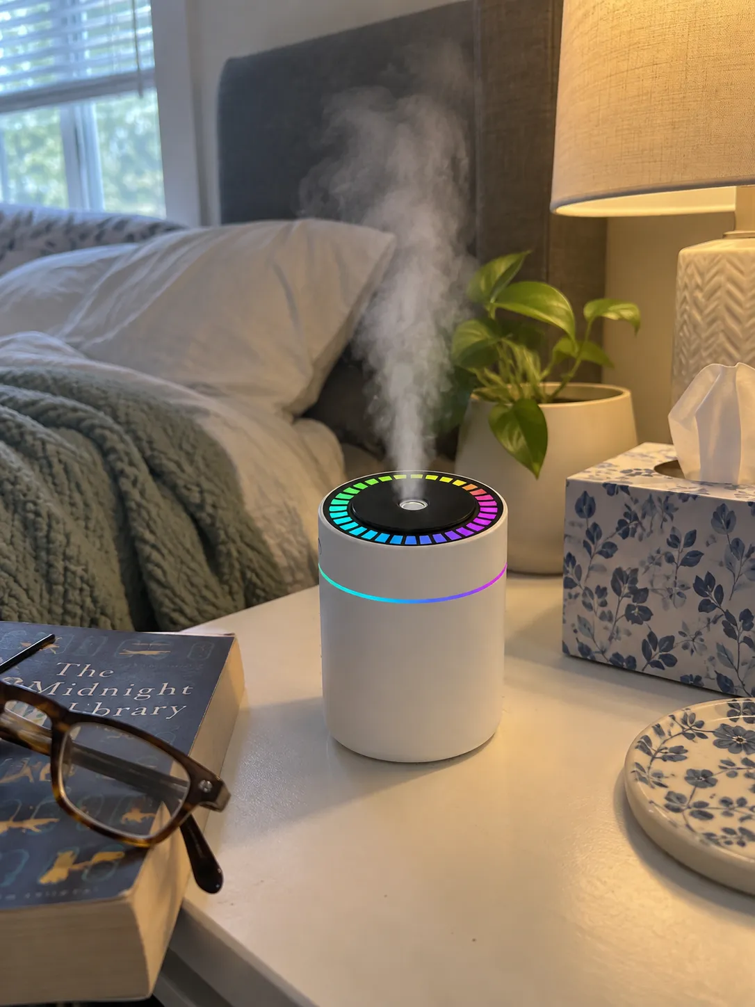 White humidifier on an everyday bedside table