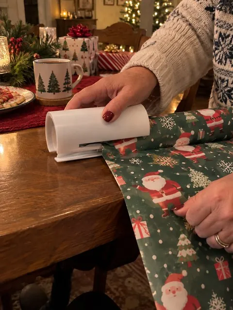 White wrapping paper cutter used at a holiday dining table