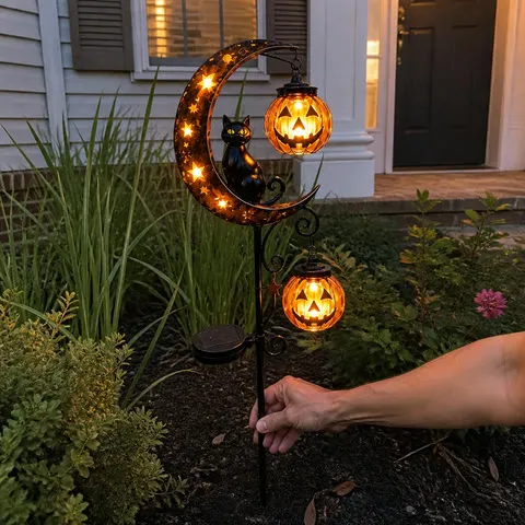 Customer-style photo of double lantern light installed in a front flower bed