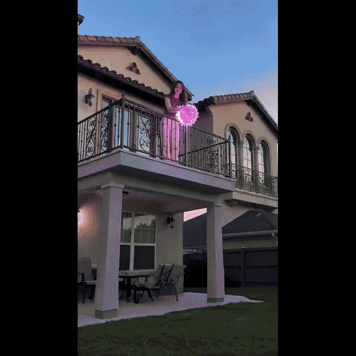 Pink string lights cycling through lighting modes