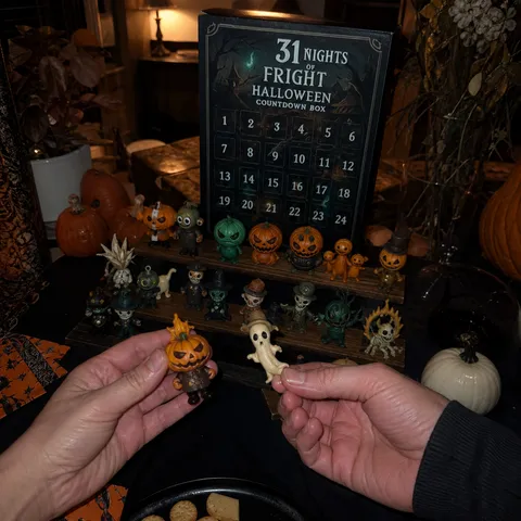 Hands holding Halloween mini figures at a party