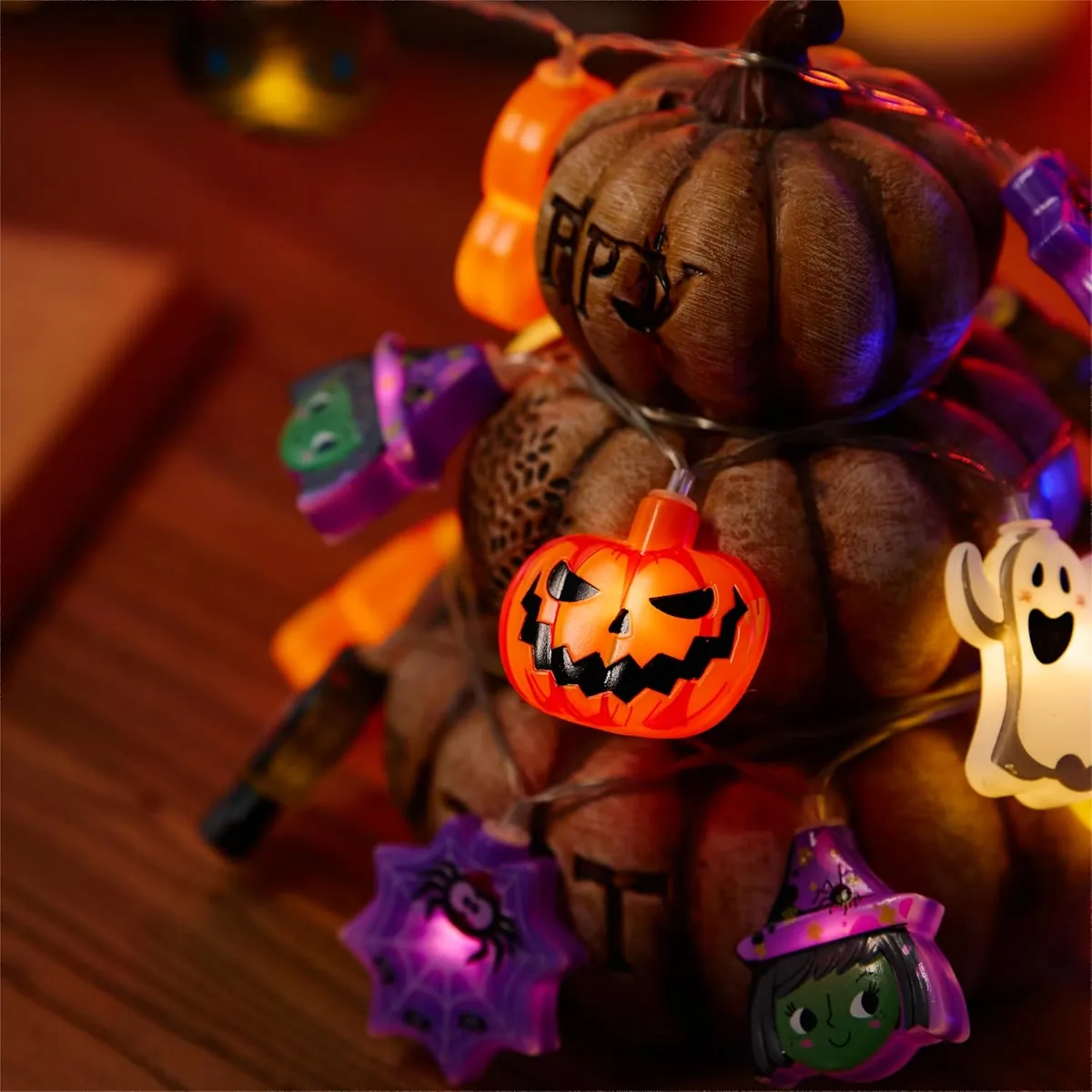 Colorful Halloween character string lights glowing in a festive display