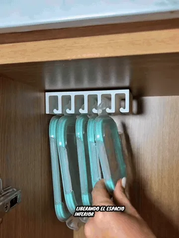 Adhesive under-shelf lid organizer being installed and used