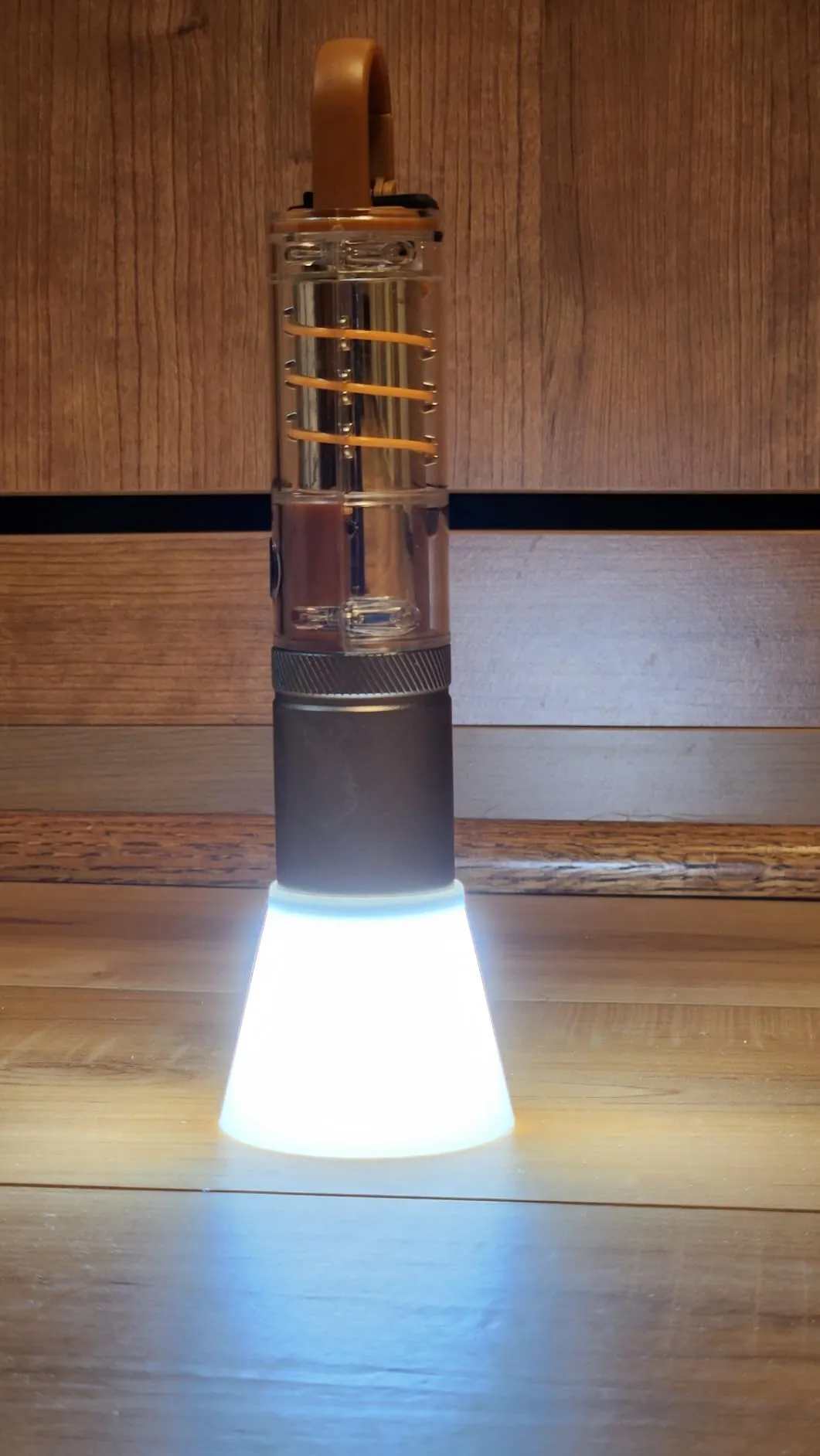 Small flashlight with a variety of functions