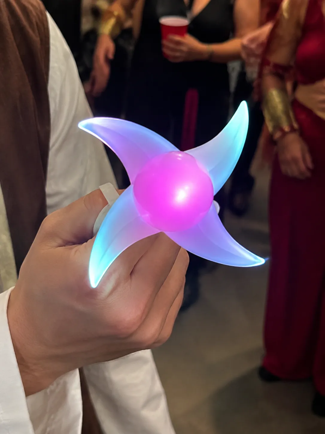 Customer holding the multicolor glow at a party