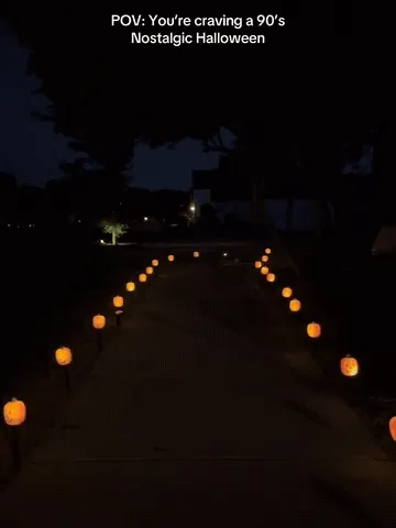 Solar pumpkin pathway lights being assembled, placed, and glowing after dark