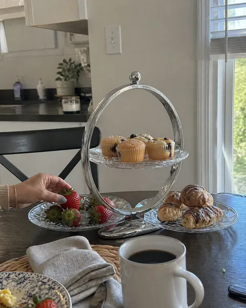 Three-tier serving stand with brunch foods in a home dining area