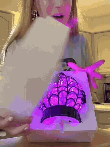 Spider globe unboxed and glowing with swirling purple glitter