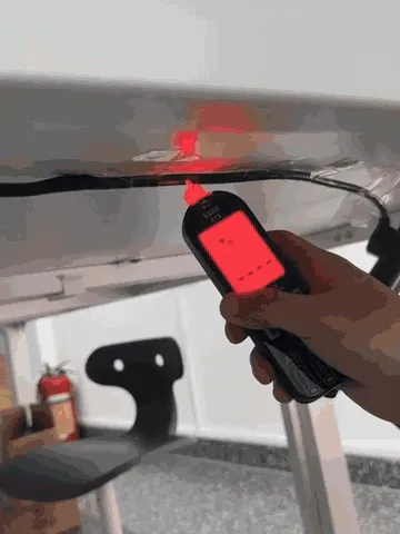 Smart pen multimeter demonstrating non-contact and probe-based electrical checks