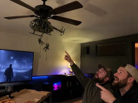 Little Bird style ceiling fan attachment in a basement game room