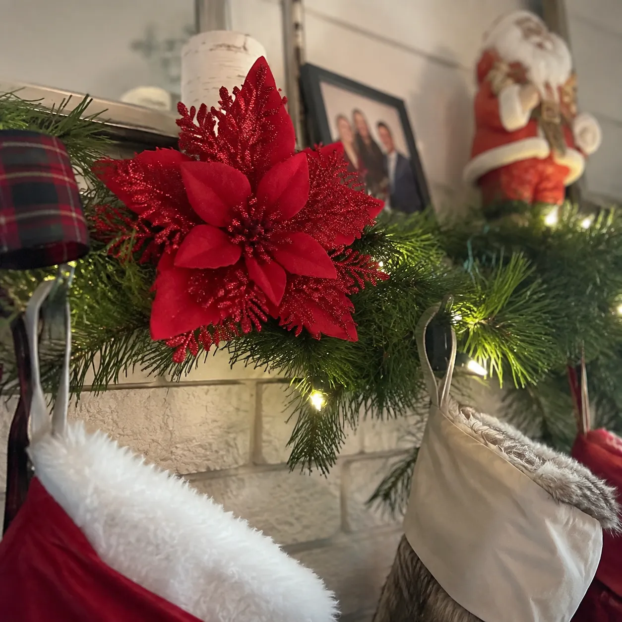 Poinsettia clip styled on a mantel garland