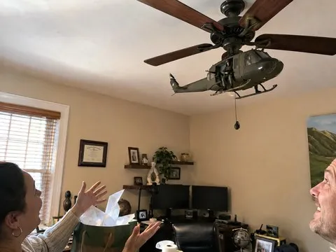 Huey style ceiling fan attachment revealed as a gift in a home office