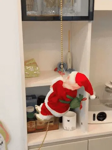 Animated Santa climbing a gold bead rope while a family watches