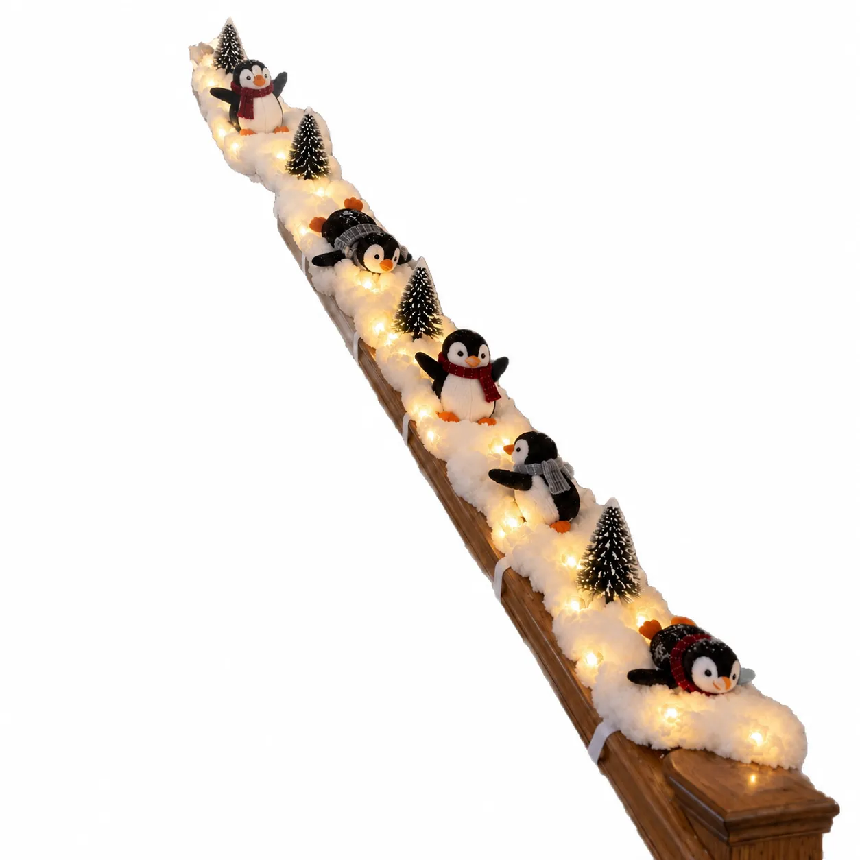 Leuchtende Pinguin-Schneegeschichte als Treppendekoration