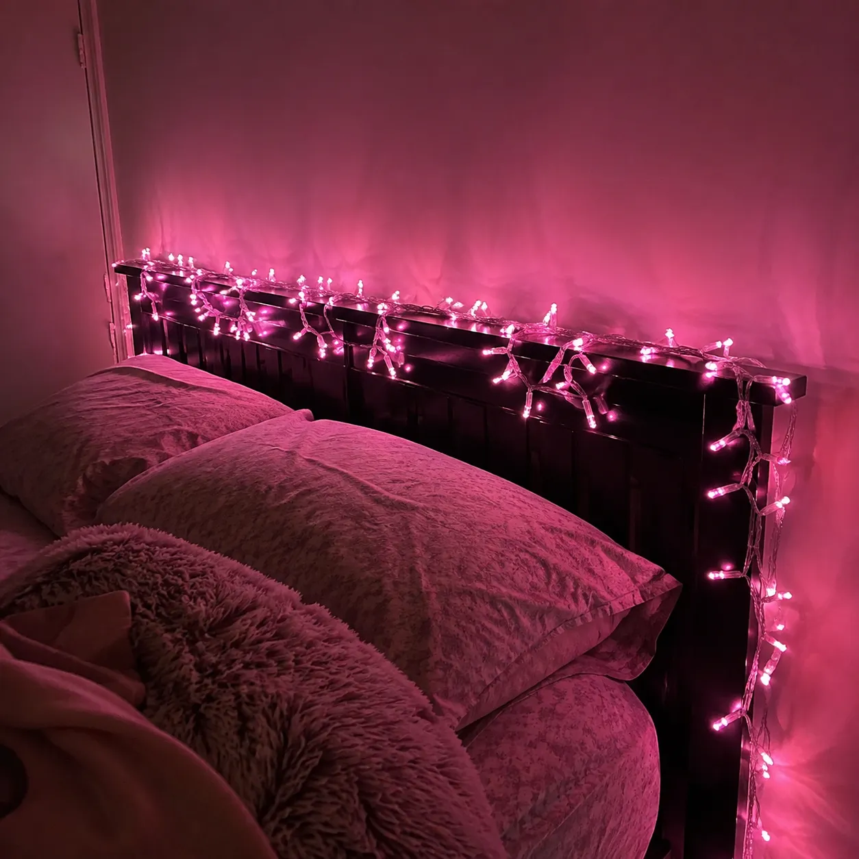 Pink lights on a headboard
