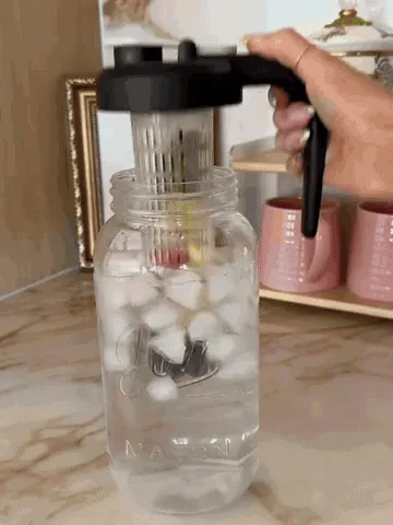 Animated demonstration of preparing and serving a chilled fruit-infused drink