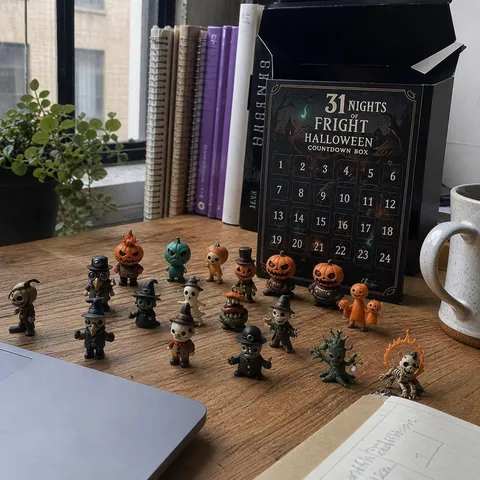 Spooky mini figures displayed on an apartment desk