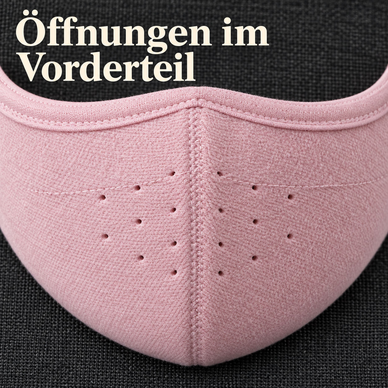 Öffnungen und textile Oberfläche im Vorderteil der rosa Maske